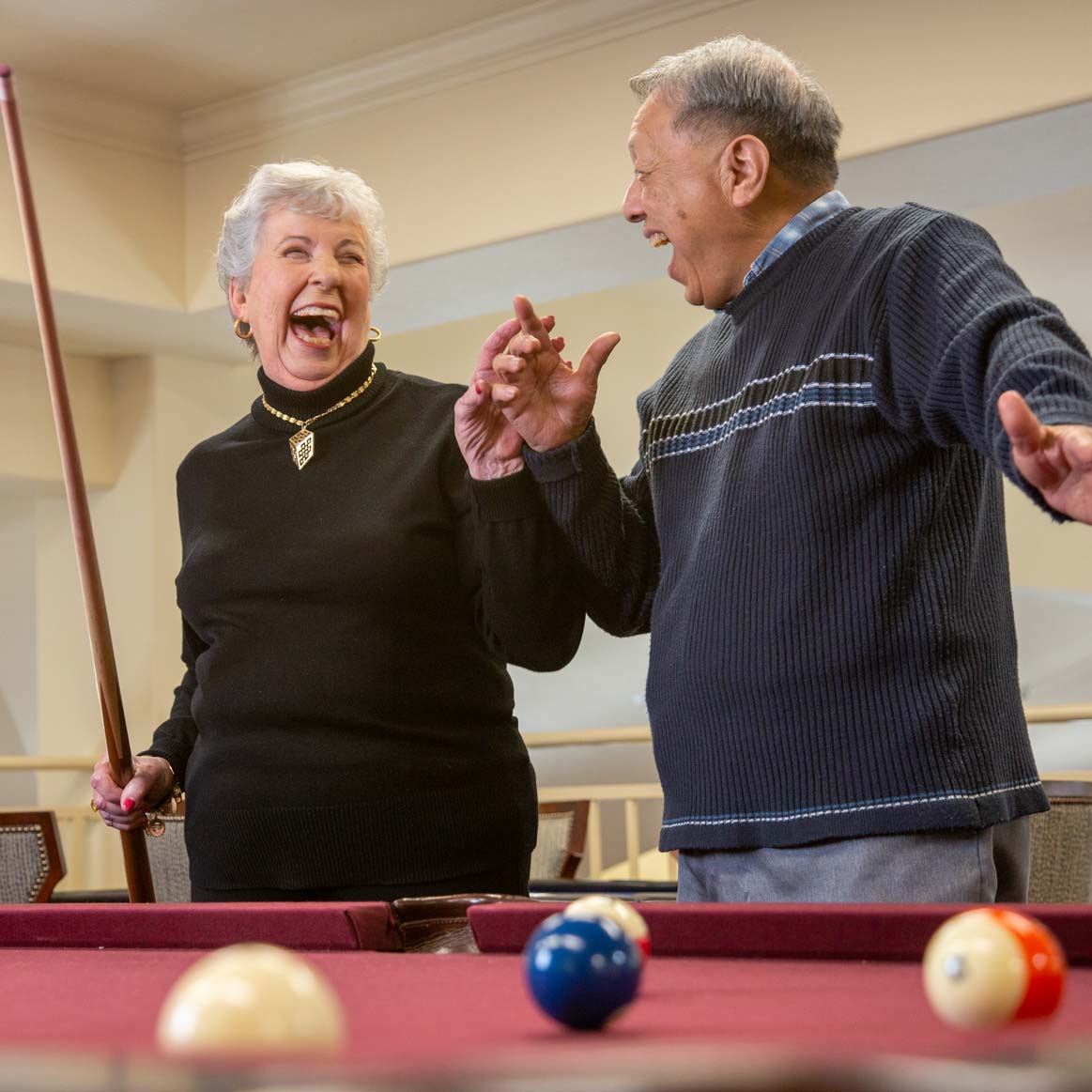 Residents playing billiards at Ashwood Meadows
